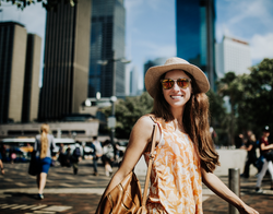 A young lady with nice skin, in an Australian city.